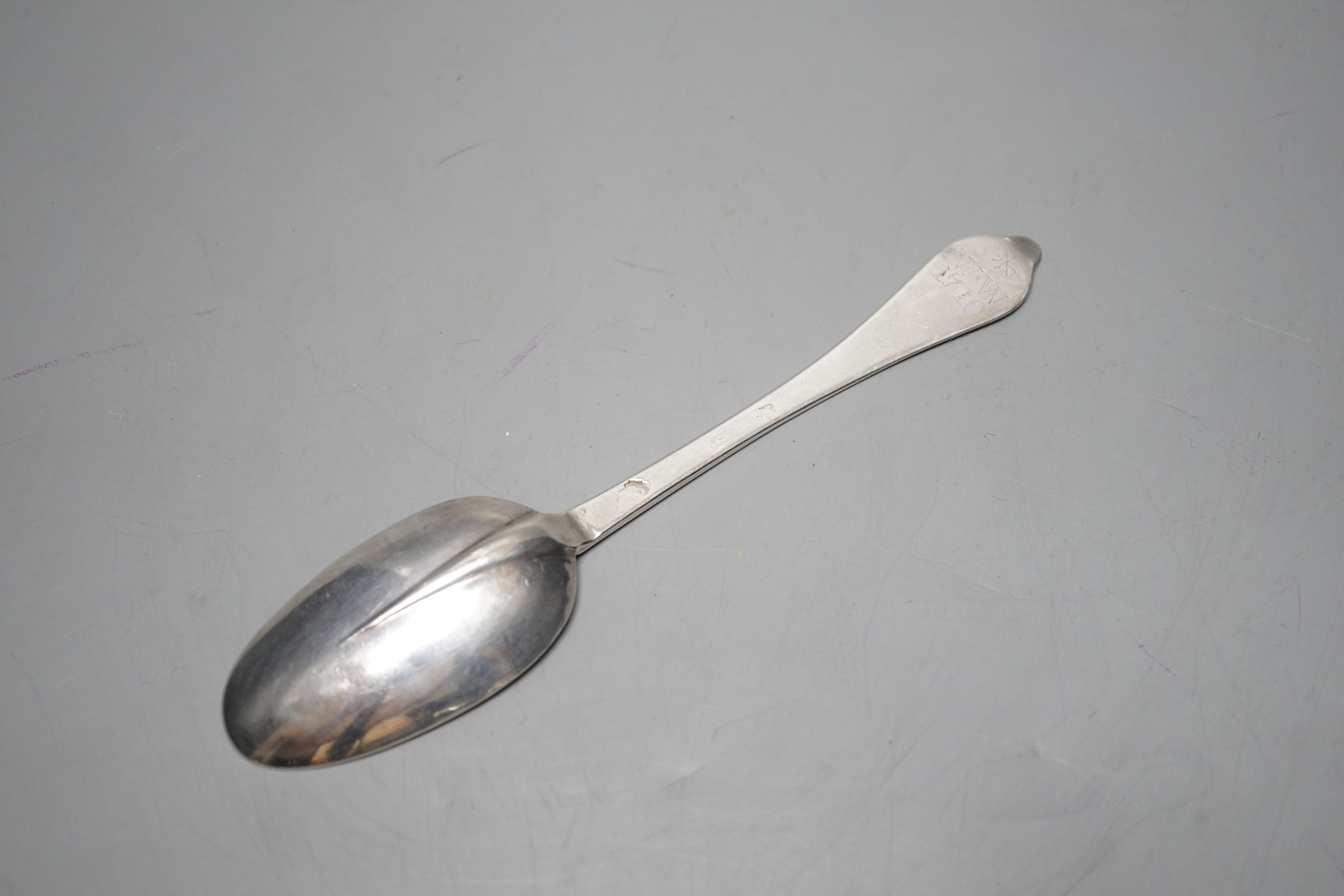 An early 18th century silver dog nose spoon, with prick dot engraved initial and date, marks rubbed, 19cm, 46 grams.